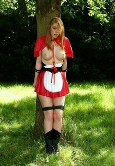 Little red riding hood tied up by the big bad wolf.